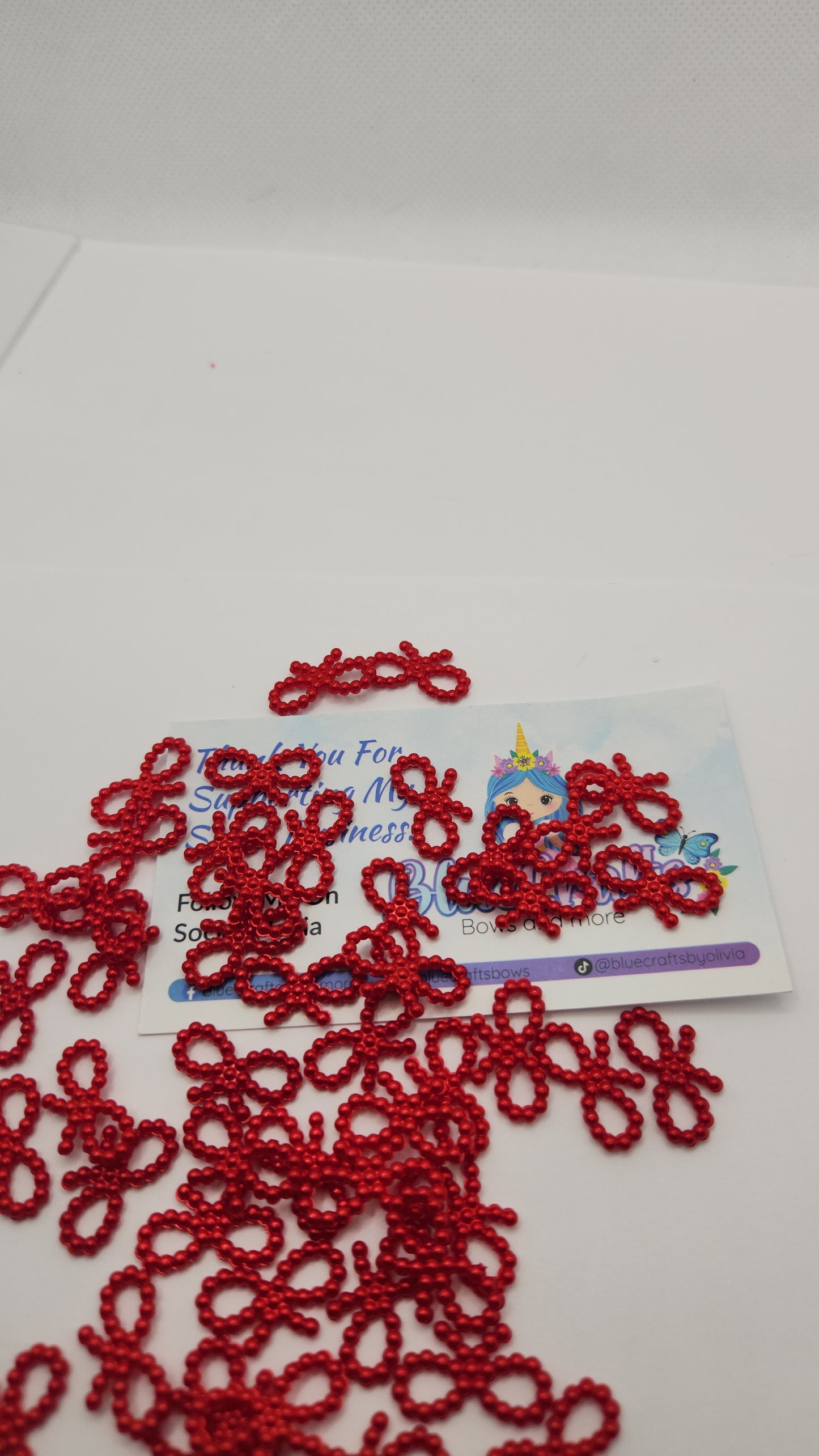 Mini pearls bows charms 50 count each set..