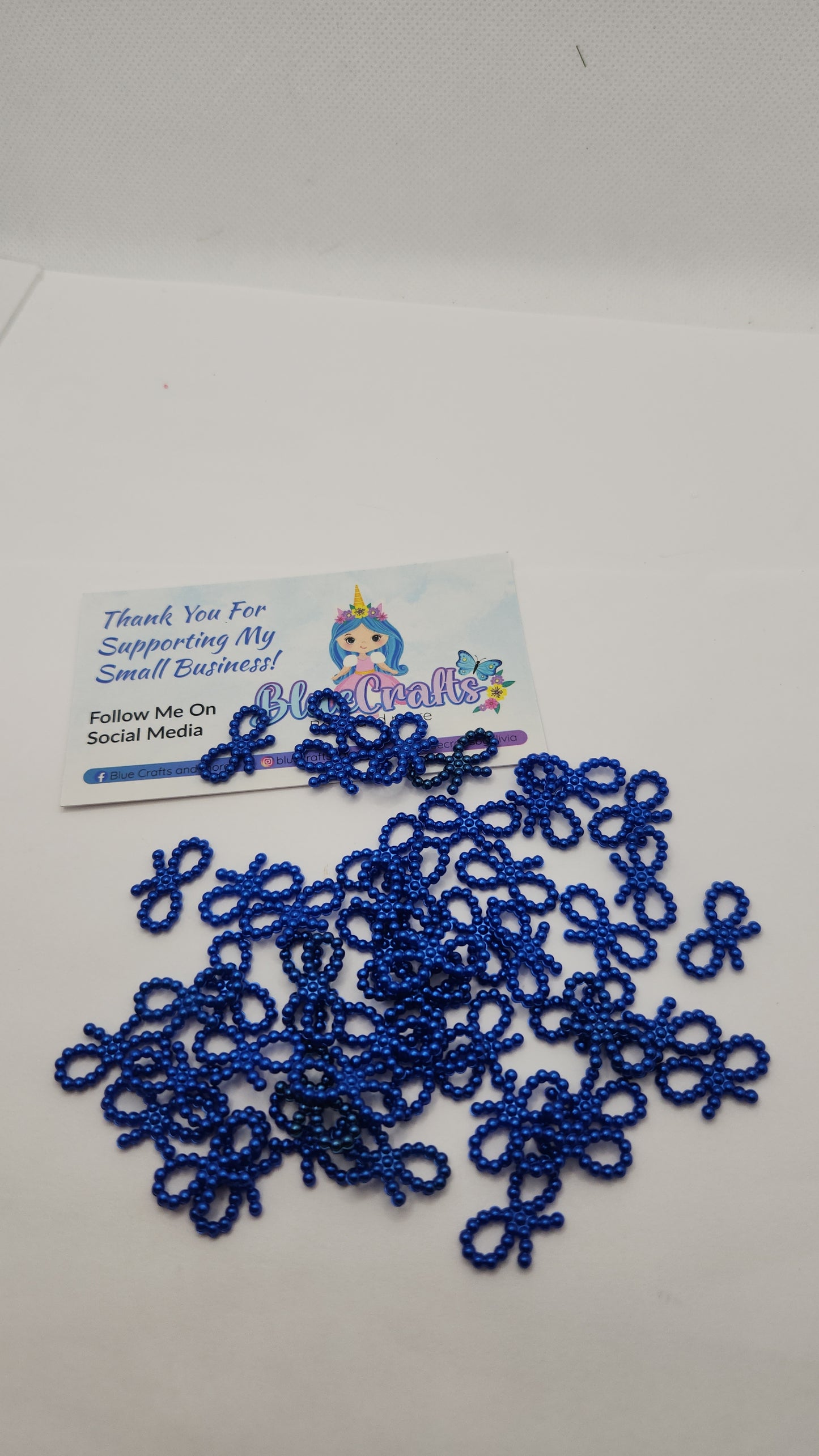 Mini pearls bows charms 50 count each set..