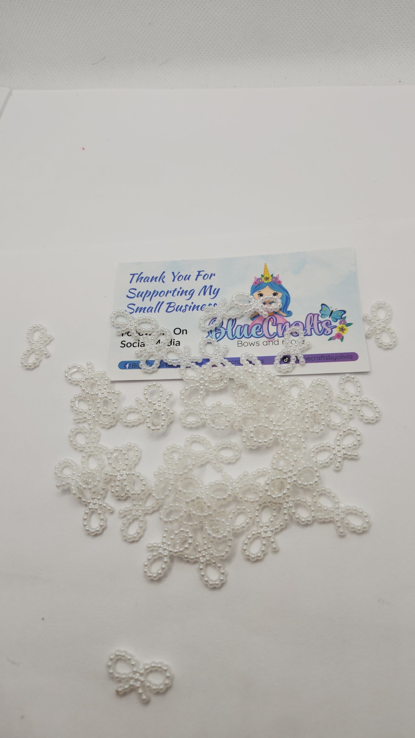 Mini pearls bows charms 50 count each set..