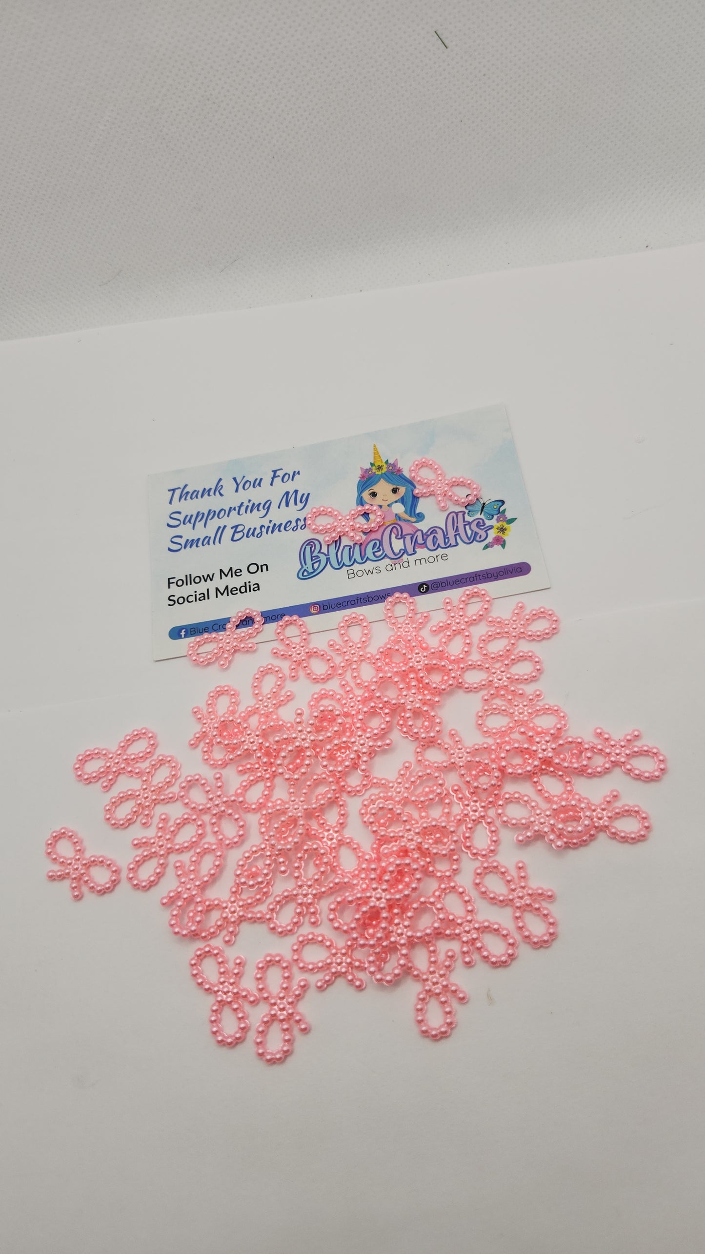 Mini pearls bows charms 50 count each set..