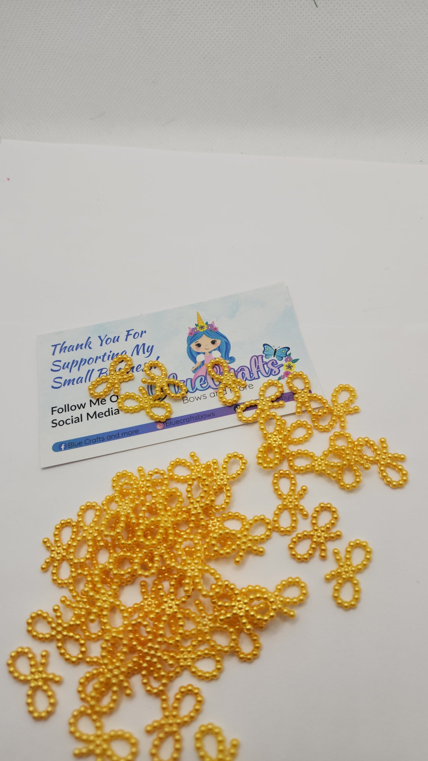 Mini pearls bows charms 50 count each set..