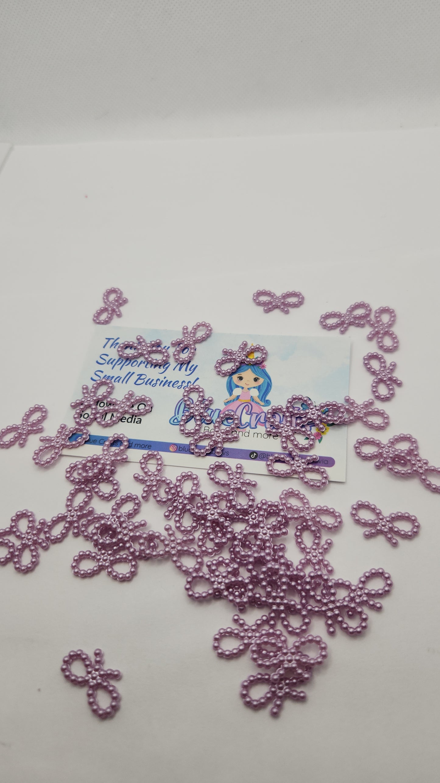 Mini pearls bows charms 50 count each set..