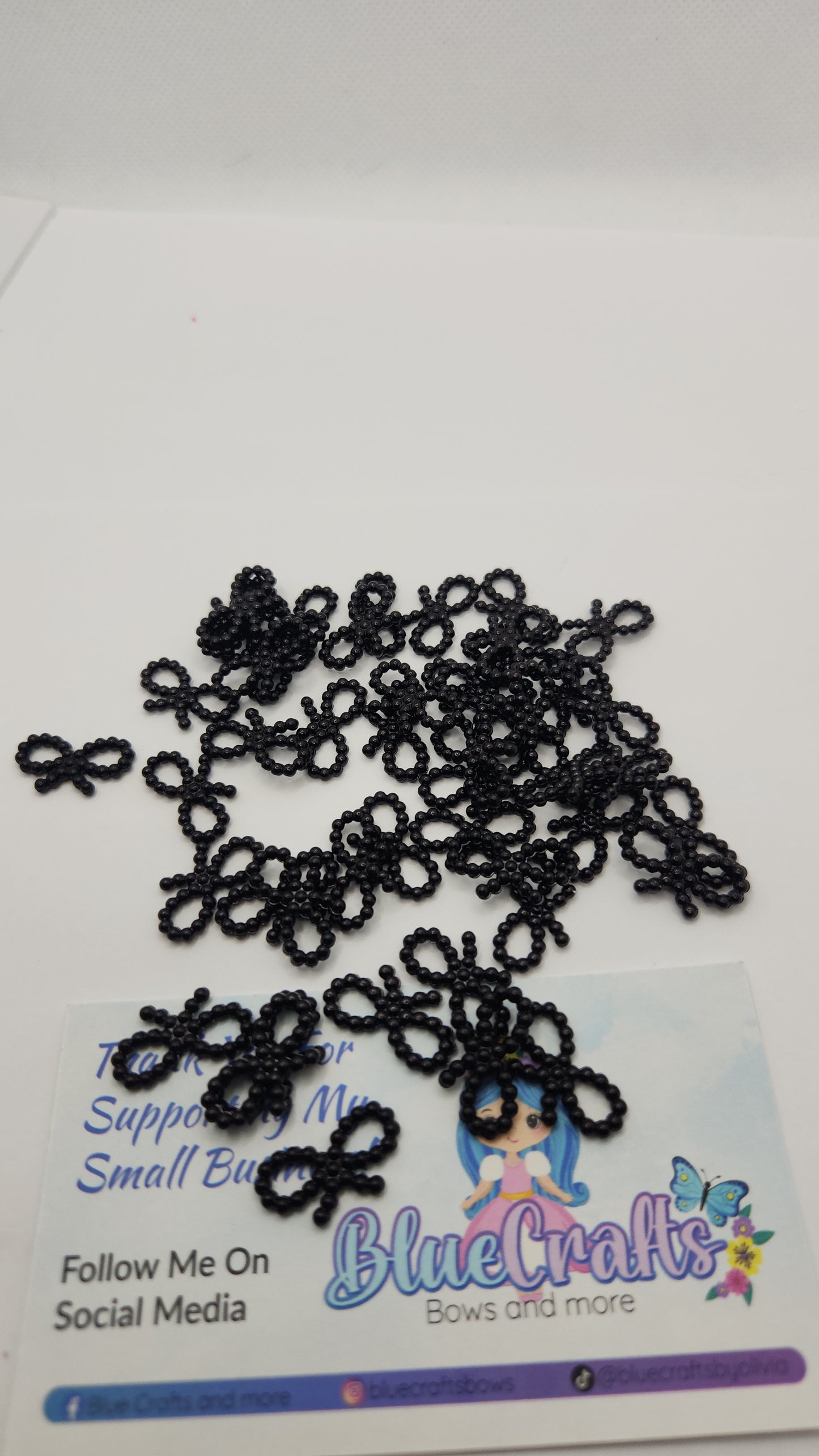 Mini pearls bows charms 50 count each set..