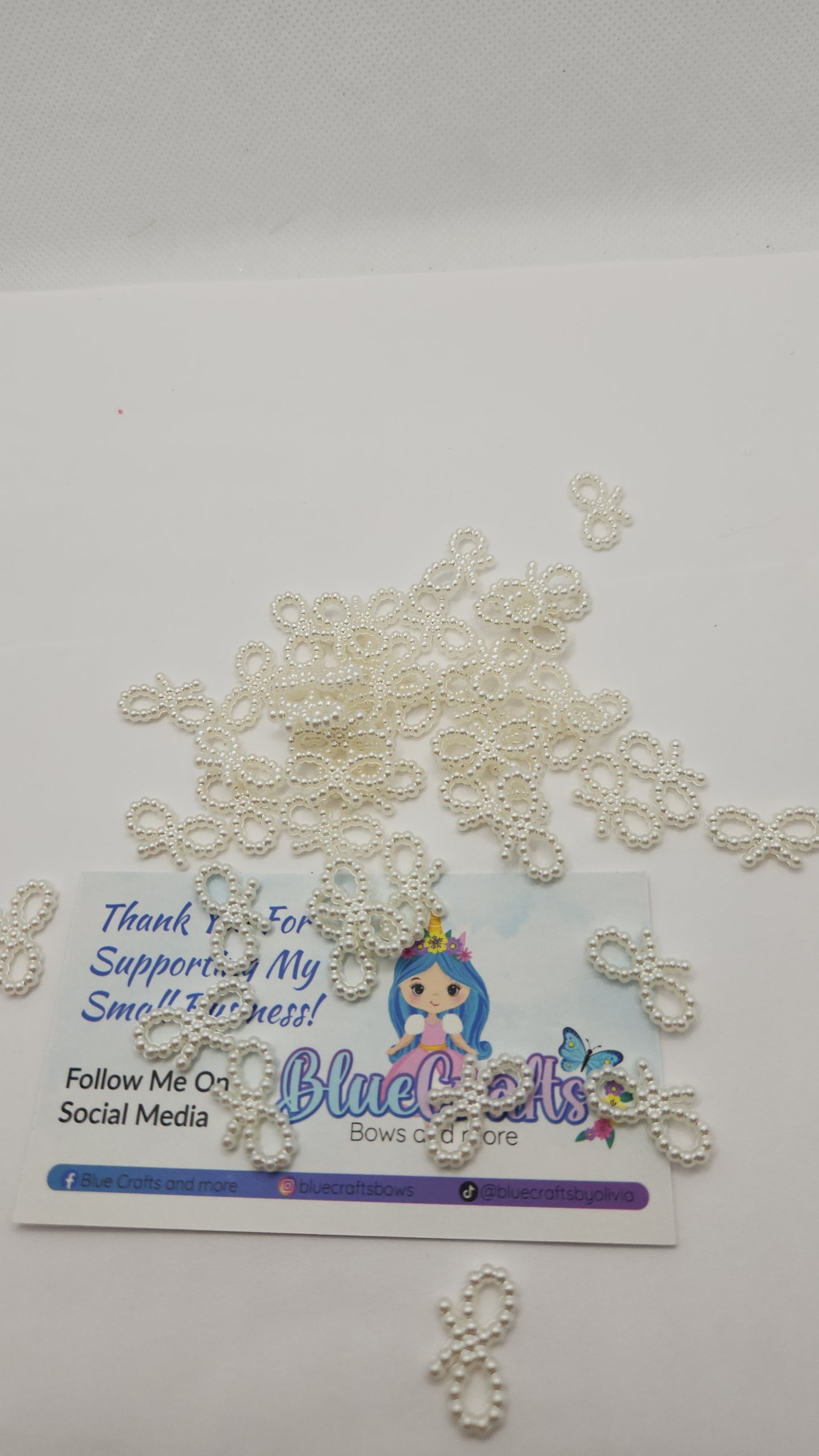 Mini pearls bows charms 50 count each set..