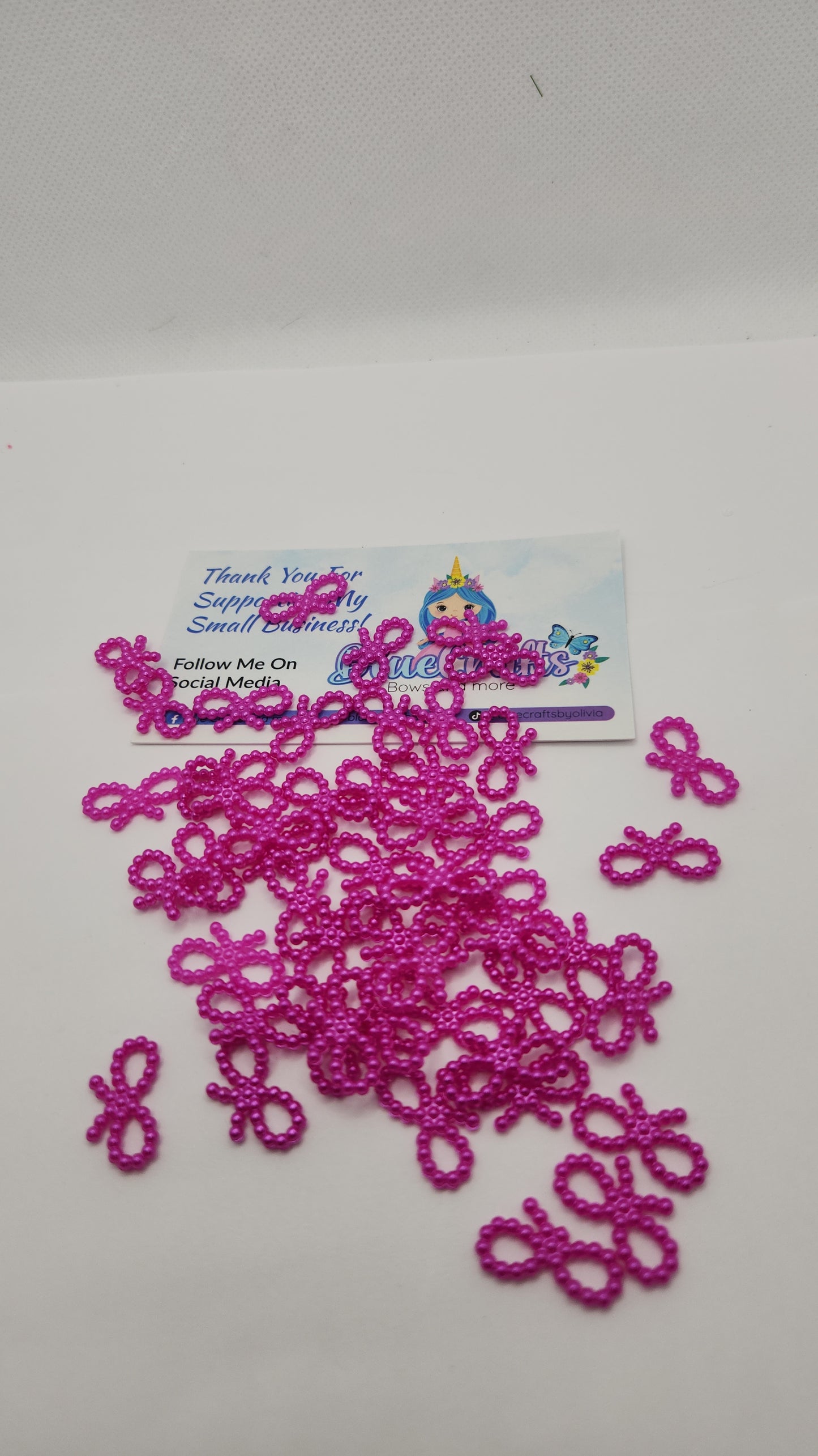 Mini pearls bows charms 50 count each set..