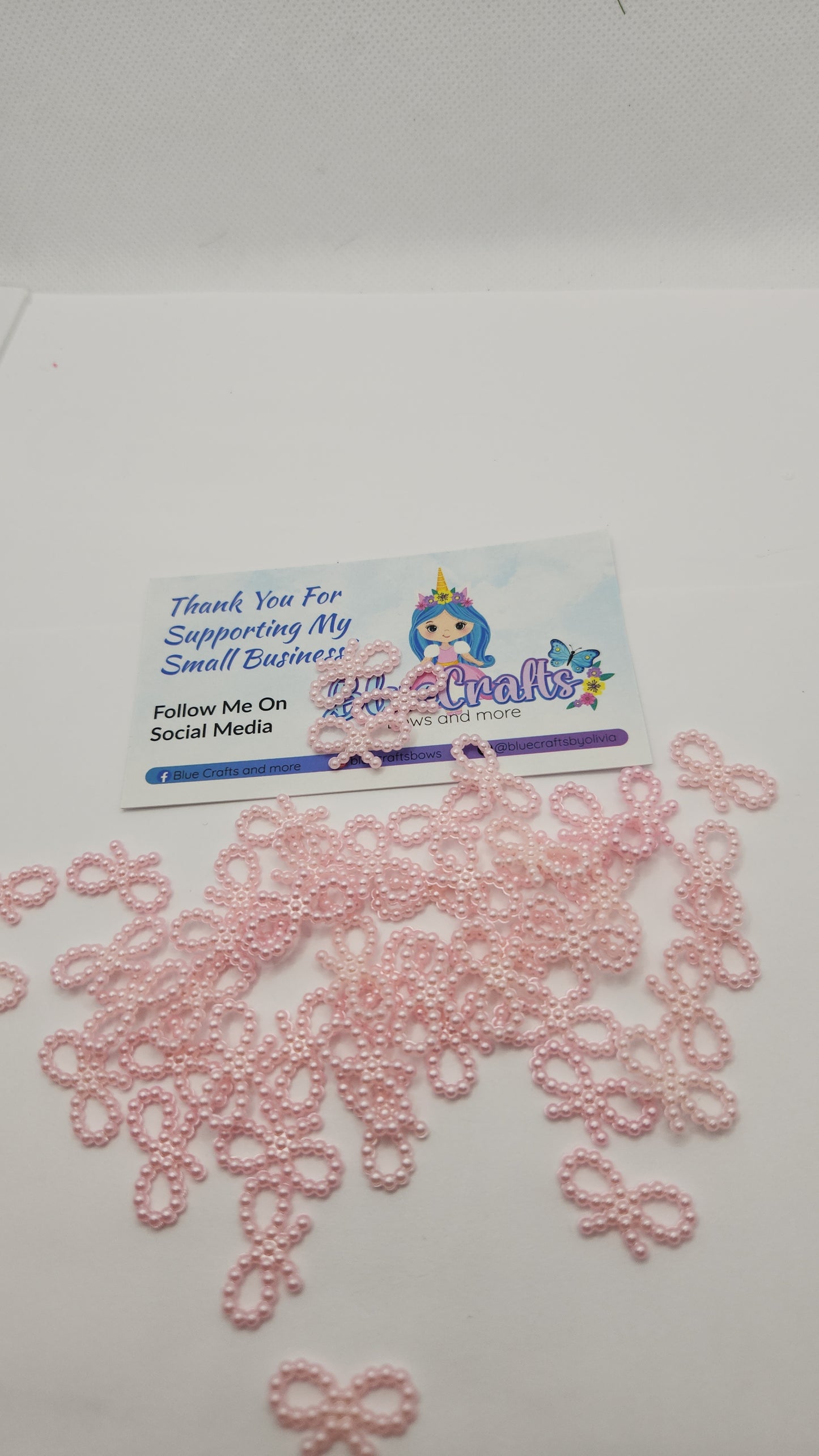 Mini pearls bows charms 50 count each set..