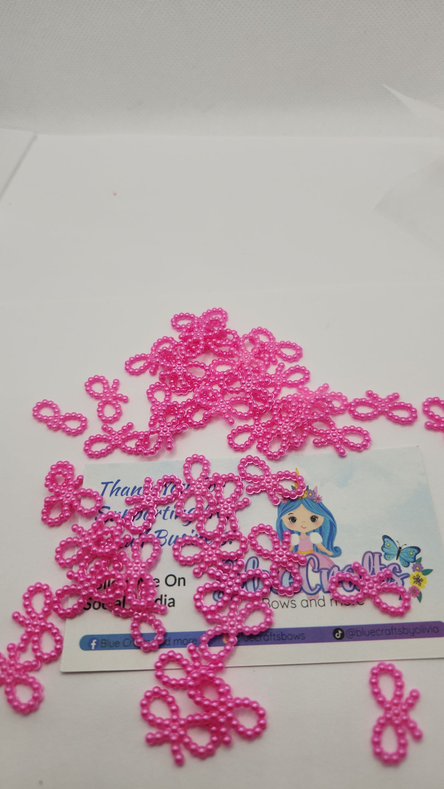 Mini pearls bows charms 50 count each set..